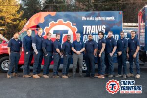 the Travis Crawford team stands in front of a branded vehicle after being featured in a Contractor Commerce case study