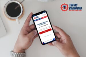 a close-up of hands holding a phone with a screen showing the online HVAC quote tool from Travis Crawford